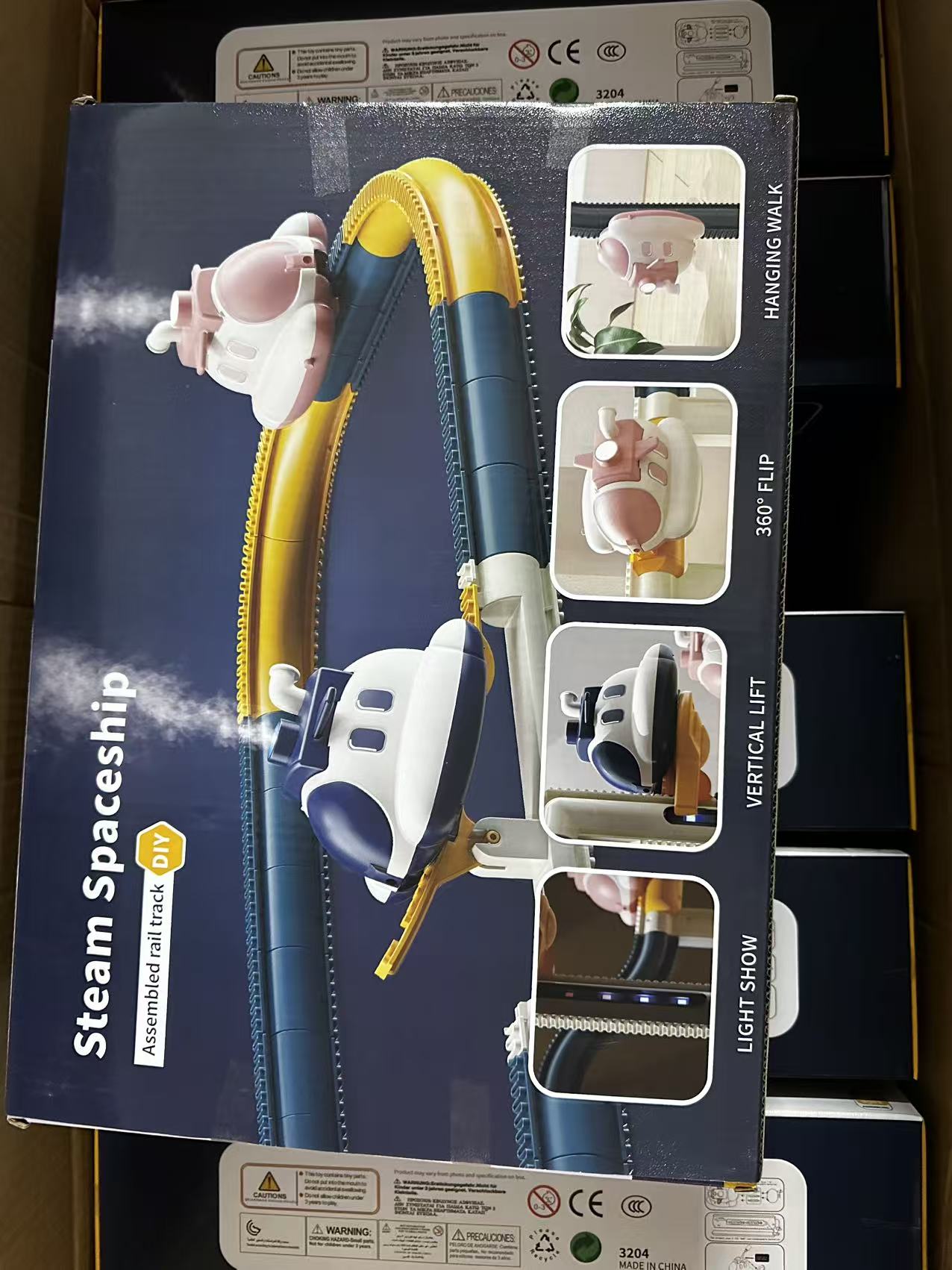 Kids electric steamship track car toy with climbing track, light effects and space adventure play design