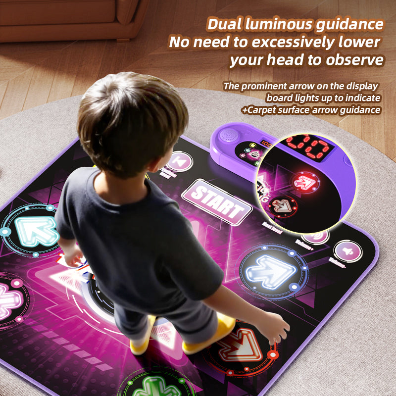 Boy playing on a light up dance mat toy with dual light guidance from the control unit display and the glowing carpet arrows