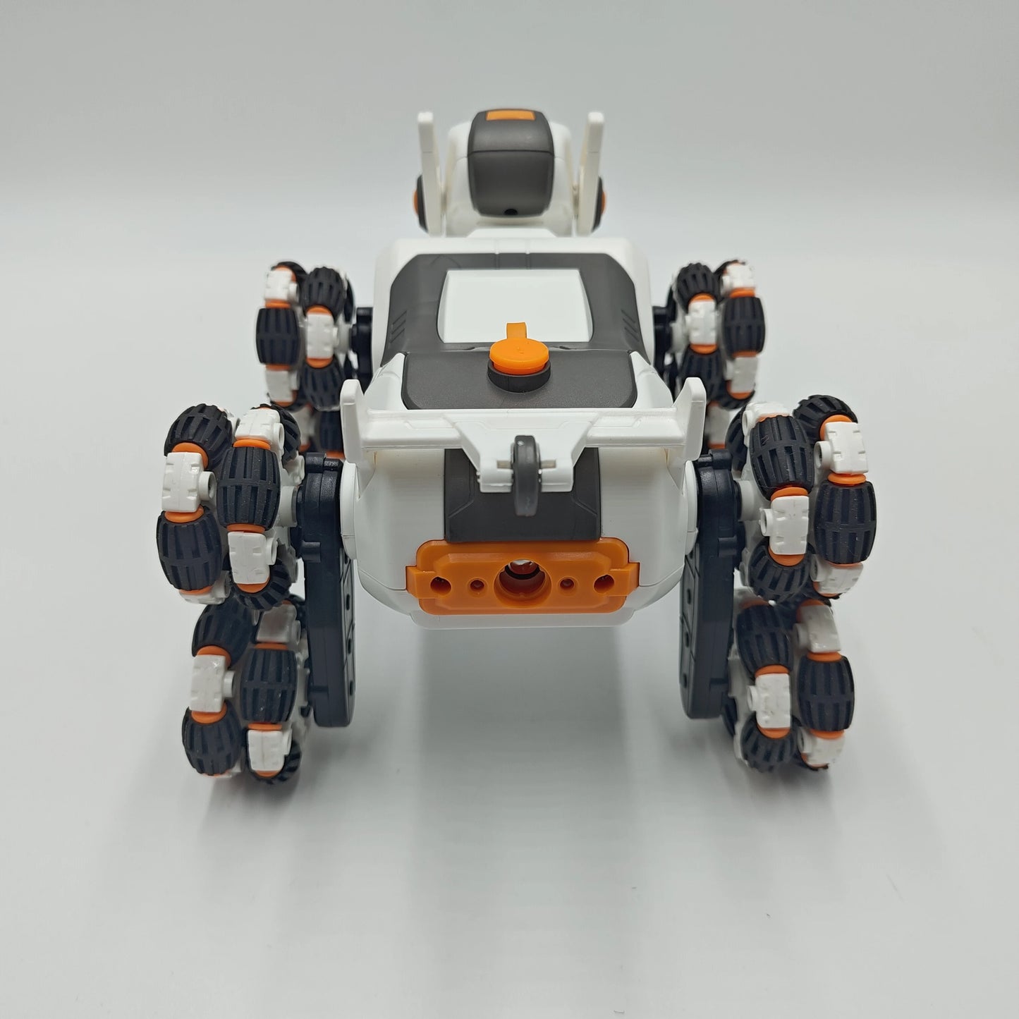 This electric remote-controlled smart robot dog kit includes a spray function, remote control, and accessories, perfect for children's exploration and entertainment.