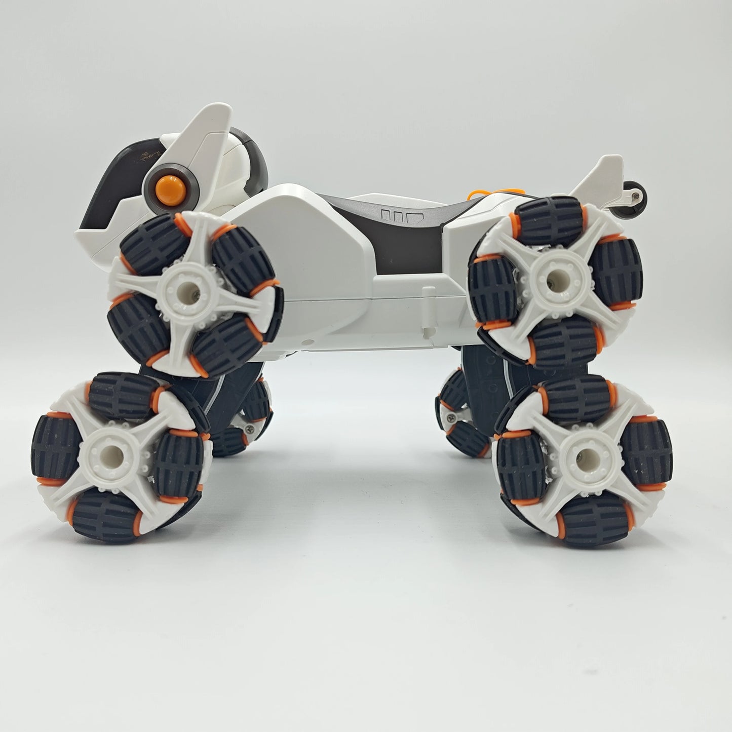This electric remote-controlled smart robot dog kit includes a spray function, remote control, and accessories, perfect for children's exploration and entertainment.